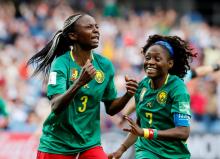 Cameroon's Ajara Nchout celebrates scoring their second goal with Gabrielle Aboudi Onguene at the Cameroon v New Zealand in Stade de La Mosson, Montpellier, France, June 20, 2019. PHOTO BY REUTERS/Jean-Paul Pelissier