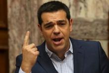 Greek Prime Minister Alexis Tsipras answers questions at parliament in Athens, Greece, July 31, 2015. PHOTO BY REUTERS/Yiannis Kourtoglou