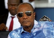 Guinea's outgoing president and presidential candidate Alpha Conde, leader of Rassemblement du Peuple de Guinea (RPG), attends the inauguration ceremony of the passenger harbor of Sandervalia in Conakry, October 8, 2015. PHOTO BY REUTERS/Luc Gnago