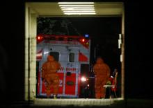 A fire brigade's special ambulance for transporting patients with highly infectious diseases arrives with an Ebola patient at the Universitaetsklinikum Frankfurt (University Hospital Frankfurt) in Frankfurt