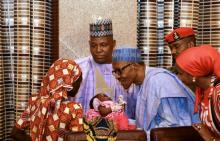 Amina Ali Darsha Nkeki, a Nigerian schoolgirl rescued after over two years of captivity with Boko Haram militants, presents her child to President Muhammadu Buhari in Abuja, Nigeria, May 19, 2016. PHOTO BY REUTERS/Afolabi Sotunde