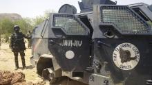 A Cameroonian soldier stands next to a Nigerian armoured vehicle used by Boko Haram insurgents to attack a Cameroon army patrol near Waza, February 17, 2015. PHOTO BY REUTERS/Bate Felix Tabi Tabe