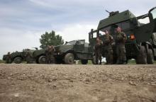 Members of the EU-Battlegroup wait for Austrian Defence Minister Norbert Darabos as he visits their barracks in Mautern about 60 kilometres (38miles) west of Vienna, May 11, 2012. PHOTO BY REUTERS/Leonhard Foeger