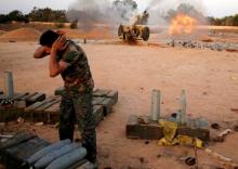 Libyan forces allied with the U.N.-backed government fire artillery towards IS fighters positions in Sirte, Libya, July 12, 2016. PHOTO BY REUTERS/Goran Tomasevic