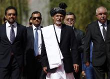 Afghanistan's new President Ashraf Ghani Ahmadzai (C) arrives for his inauguration as president in Kabul