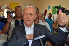 Sunni politician Ashraf Rifi shows his ink-stained finger after casting his ballot at a polling station during Tripoli's municipal elections, Lebanon, May 29, 2016. PHOTO BY REUTERS/Stringer