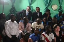 An audience follows presidential candidates Faustin-Archange Touadera and Anicet-Georges Dologuele facing each other during a live television debate ahead of Sunday's second round election, in Bangui, Central African Republic, February 12, 2016. PHOTO BY REUTERS/Siegfried Modola