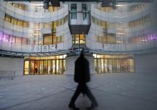 A man walks past the BBC's New Broadcasting House in London, December 19, 2012. PHOTO BY REUTERS/Luke MacGregor
