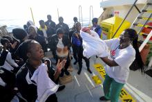 Migrants dance and sing to celebrate the birth of Miracle, a baby who was born on board the Aquarius, in the central Mediterranean Sea, May 26, 2018. PHOTO BY REUTERS/Guglielmo Mangiapane