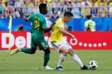 Colombia's James Rodriguez in action with Senegal's Ismaila Sarr. PHOTO BY REUTERS/Carlos Garcia Rawlins