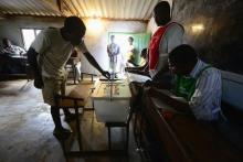 A man casts his ballot at a voting station in a file photo. PHOTO BY REUTERS/Grant Lee Neuenburg