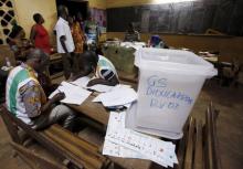 Polling workers count the ballots at a polling station in Yamoussoukro Ivory Coast, October 25, 2015. PHOTO BY REUTERS/ Thierry Gouegnon