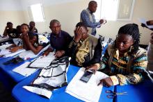 Congo's Independent National Electoral Commission (CENI) officials check presidential elections polling stations voting forms at tallying centre in Kinshasa, Democratic Republic of Congo, January 4, 2019. PHOTO BY REUTERS/Baz Ratner