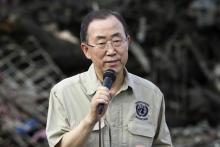 U.N. Secretary-General Ban Ki-moon speaks to members of the media after inspecting a devastated area of Fatima village at Tacloban city, central Philippines