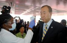 U.N. Secretary General Ban Ki-moon has his temperature checked upon arrival at the Roberts International airport in Liberia's capital Monrovia, December 19, 2014. PHOTO BY REUTERS/James Giahyue