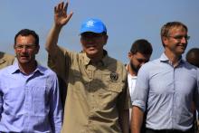 U.N. Secretary-General Ban Ki-moon (C) waves to members of the media during his visit to an IDP (internally displaced persons) camp in the United Nations Mission in South Sudan (UNMISS) base at Thong Ping in Juba