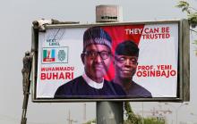 Workers fix an election campaign billboard depicting Nigeria's President Muhammadu Buhari and his Vice President, Yemi Osinbajo in Abuja, Nigeria, January 30, 2019. PHOTO BY REUTERS/Afolabi Sotunde