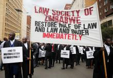 HARARE (Reuters) - Hundreds of Zimbabwean lawyers marched on Tuesday to demand justice for people detained in jail and others facing fast-track trials after violent protests this month led to mass arrests and a brutal security crackdown.  The southern African nation has been on edge since the crackdown, during which residents and other witnesses say police and soldiers conducted night-time raids on many homes and forcibly removed and beat alleged protesters.  The main teachers' union announced on Tuesday th