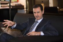 Syria's President Bashar al-Assad speaks during an interview with French magazine Paris Match,in Damascus,in this handout released by Syria's national news agency SANA, December 4,2014. PHOTO BY REUTERS/SANA