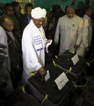 Sudan's President Omar Hassan al-Bashir (C) casts his ballot during electons in the capital Khartoum April 13, 2015. PHOTO BY REUTERS/Mohamed Nureldin Abdallah