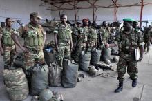 Benin soldiers stand in preparation to leave for their deployment to Mali, in the capital Cotonou, January 18, 2013. PHOTO BY REUTERS/Charles Placide