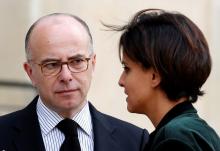 French Interior Minister Bernard Cazeneuve (L) speaks with Education and Research minister Najat Vallaud-Belkacem as they leave after a meeting on Ebola at the Elysee Palace in Paris, October 13, 2014. PHOTO BY REUTERS/Charles Platiau