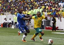 South Africa's Bernard Parker (R) is challenged by Mohamed Kamara of Sierra Leone during their 2012 African Nations Cup Group G qualifier soccer match at the Mbombela Stadium in Nelspruit, October 8, 2011.  PHOTO BY REUTERS/Siphiwe Sibeko