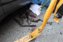 Bloodstains are seen next to the car belonging to Iranian nuclear scientist Mostafa Ahmadi-Roshan at a blast site outside a university in northern Tehran, January 11, 2012. PHOTO BY REUTERS/IIPA/Sajad Safari