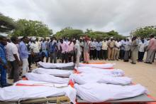 Relatives prepare to pray near the wrapped bodies of people killed in an attack by Somali forces and supported by U.S. troops before their burial, in Mogadishu, Somalia, August 31, 2017. PHOTO BY REUTERS/Feisal Omar