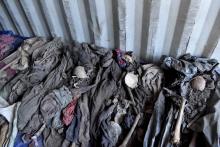 The remains of bodies of unidentified people who were exhumed from mass graves identified following an investigation by the Truth and Reconciliation Commission are seen inside a shipping container in Kamenge in the north of Bujumbura, Burundii, January 13, 2020. PHOTO BY REUTERS/Stringer