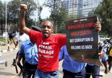 Kenyan activist Boniface Mwangi is detained by police during a street protest on corruption in Kenya's capital Nairobi, December 1, 2015. PHOTO BY REUTERS/Noor Khamis