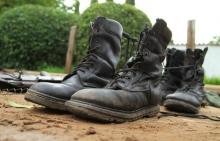 Military boots are displayed after they were recovered from suspected fighters following clashes in the capital Bujumbura, Burundi, December 12, 2015. PHOTO BY REUTERS/Jean Pierre Aime Harerimana