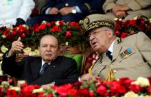 Algeria's President Abdelaziz Bouteflika gestures while talking with Army Chief of Staff General Ahmed Gaed Salah during a graduation ceremony of the 40th class of the trainee army officers at a Military Academy in Cherchell 90 km west of Algiers, Algeria, June 27, 2012. PHOTO BY REUTERS/Ramzi Boudina
