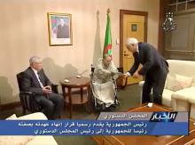 Algerian President Abdelaziz Bouteflika hands over resignation letter to constitutional council head Tayeb Belaiz as upper house chairman Abdelkader Bensalah (L) looks on, in Algeria, April 2, 2019, in this still image from Algerian State TV video. PHOTO BY REUTERS/Algerian State TV