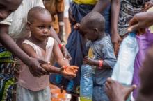 A refugee boy from Burundi who fled the ongoing violence and political tension washes his hands at the Nyarugusu refugee camp in western Tanzania, May 28, 2015. PHOTO BY REUTERS/Sala Lewis