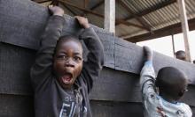 A Congolese boy displaced by recent fighting in North Kivu, yawns at the child friendly space (CFS) within Mugunga III camp for the internally displaced people near Goma, eastern Democratic Republic of Congo