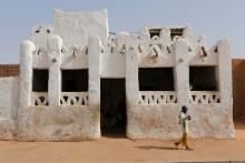 A boy walks out of a religious school in Agadez, Niger, May 11, 2016. PHOTO BY REUTERS/Joe Penney