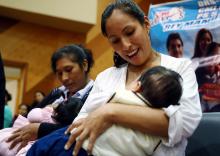 Women breastfeed their babies during a breastfeeding contest organized by Peru's Health Ministry in Lima, Peru, August 26, 2016. PHOTO BY REUTERS/Mariana Bazo