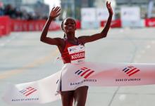 Kenya's Brigid Kosgei crosses the finish line winning the women's marathon and setting a new world record. PHOTO BY REUTERS/Mike Segar
