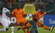 Ghana's goalkeeper Brimah Razak saves the ball against Ivory Coast's Serge Aurier (R) and Seydou Doumbia (C) during the African Nations Cup final soccer match in Bata, February 8, 2015. REUTERS/Amr Abdallah Dalsh