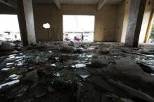 Broken glass is pictured on the floor of a looted store following violent protests in Kinshasa, Democratic Republic of Congo, January 23, 2015. PHOTO BY REUTERS/Rey Byhre