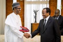 Nigeria's President Muhammadu Buhari(L) shakes hands with Cameroon's President Paul Biya(R) as he arrives on an official visit to Cameroon in Yaounde, July 29, 2015. PHOTO BY REUTERS/Bayo Omoboriowo