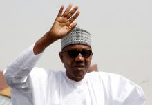 Nigeria's President Muhammadu Buhari greets his supporters after Friday prayers in his hometown Daura, in Katsina State, ahead of the country's presidential election, Nigeria, February 15, 2019. PHOTO BY REUTERS/Luc Gnago