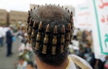 A man wearing a bullet belt on his head takes part in an anti-Israeli rally to show solidarity with Al-Aqsa mosque, in Sanaa, Yemen, July 21, 2017. PHOTO BY REUTERS/Khaled Abdullah