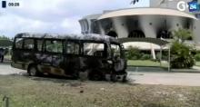 A still image from video of a fire damaged vehicle outside the national assembly building in Libreville, Gabon, September 2, 2016. PHOTO BY REUTERS/GABON 24 TV