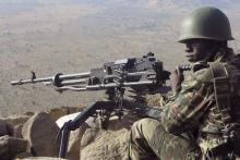 A Cameroonian soldier guards at an observation post on a hill in the Mandara Mountain chain in Mabass overlooking Nigeria, northern Cameroon, February 16, 2015. PHOTO BY REUTERS/Bate Felix Tabi Tabe