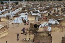 People walk inside the Muna Internally displace people camp in Maiduguri, Nigeria, December 1, 2016. PHOTO BY REUTERS/Afolabi Sotunde