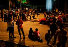 People gather in a public square that has become an informal camp for several hundred undocumented Venezuelan migrants in Bucaramanga, Colombia August 27, 2018. The migrants sleep on cardboard, under open garbage bins, or in donated tents. PHOTO BY REUTERS/Carlos Garcia Rawlins