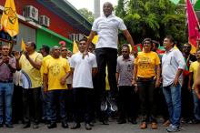 Ibrahim Mohamed Solih, Maldivian presidential candidate backed by the opposition coalition, jumps next to his supporters during the final campaign rally ahead of the presidential election in Male, Maldives, September 22, 2018. PHOTO BY REUTERS/Ashwa Faheem