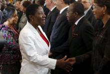 Presidential candidates Jacqueline-Claire Kouangoua (L) and Henriette Lagou (2nd L) arrive for the signing of a 'code of conduct' at the Presidential Palace in Abidjan, October 7, 2015. PHOTO BY REUTERS/ Thierry Gouegnon